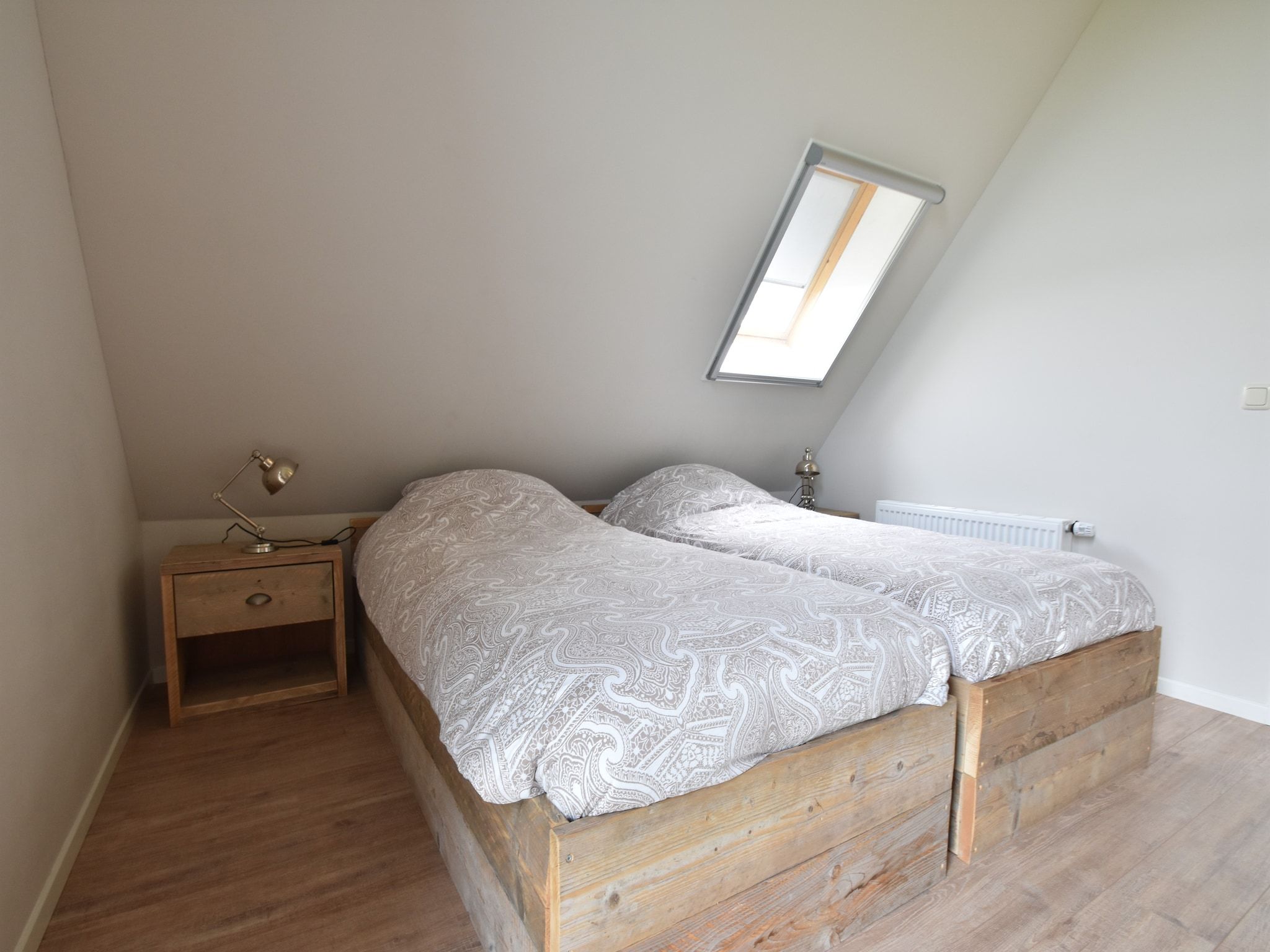 Een slaapkamer van Zeedijk I in Tzummarum