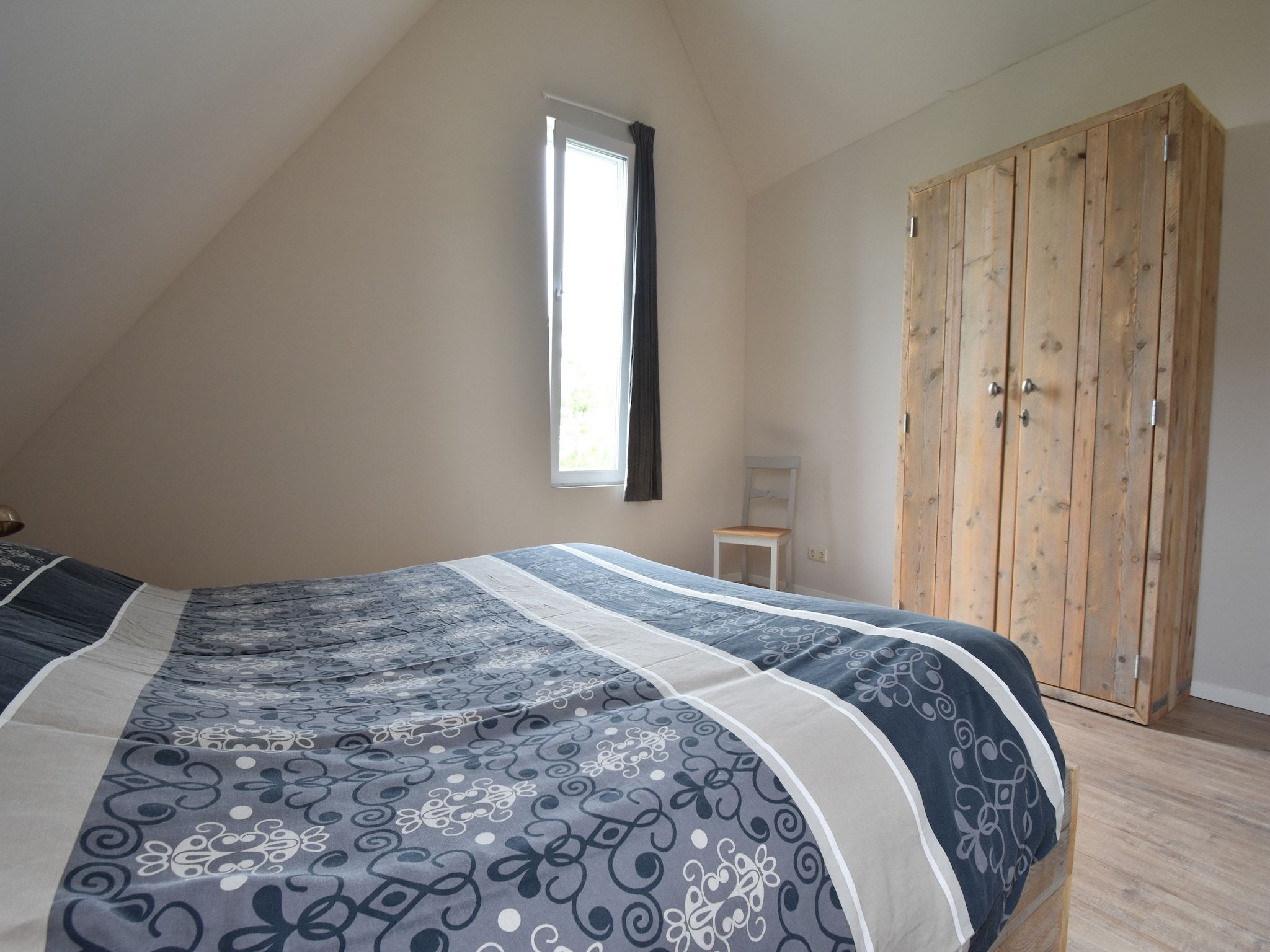 Een slaapkamer van Zeedijk I in Tzummarum