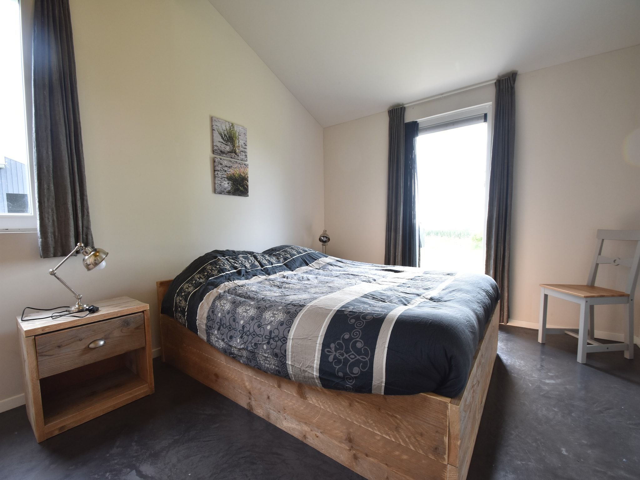 Een slaapkamer van Zeedijk I in Tzummarum