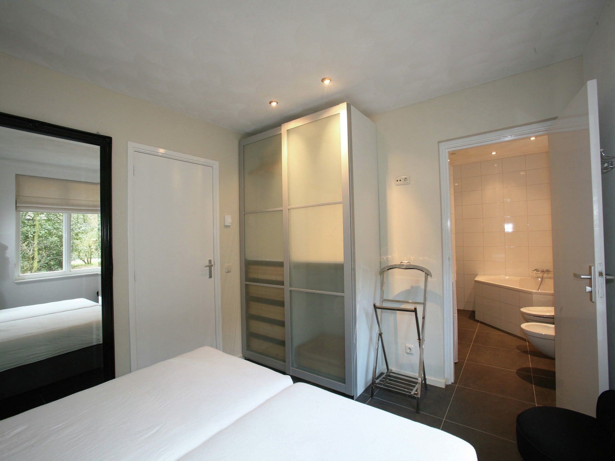 Een slaapkamer van Vakantiepark Sandberghe 2 in Uden