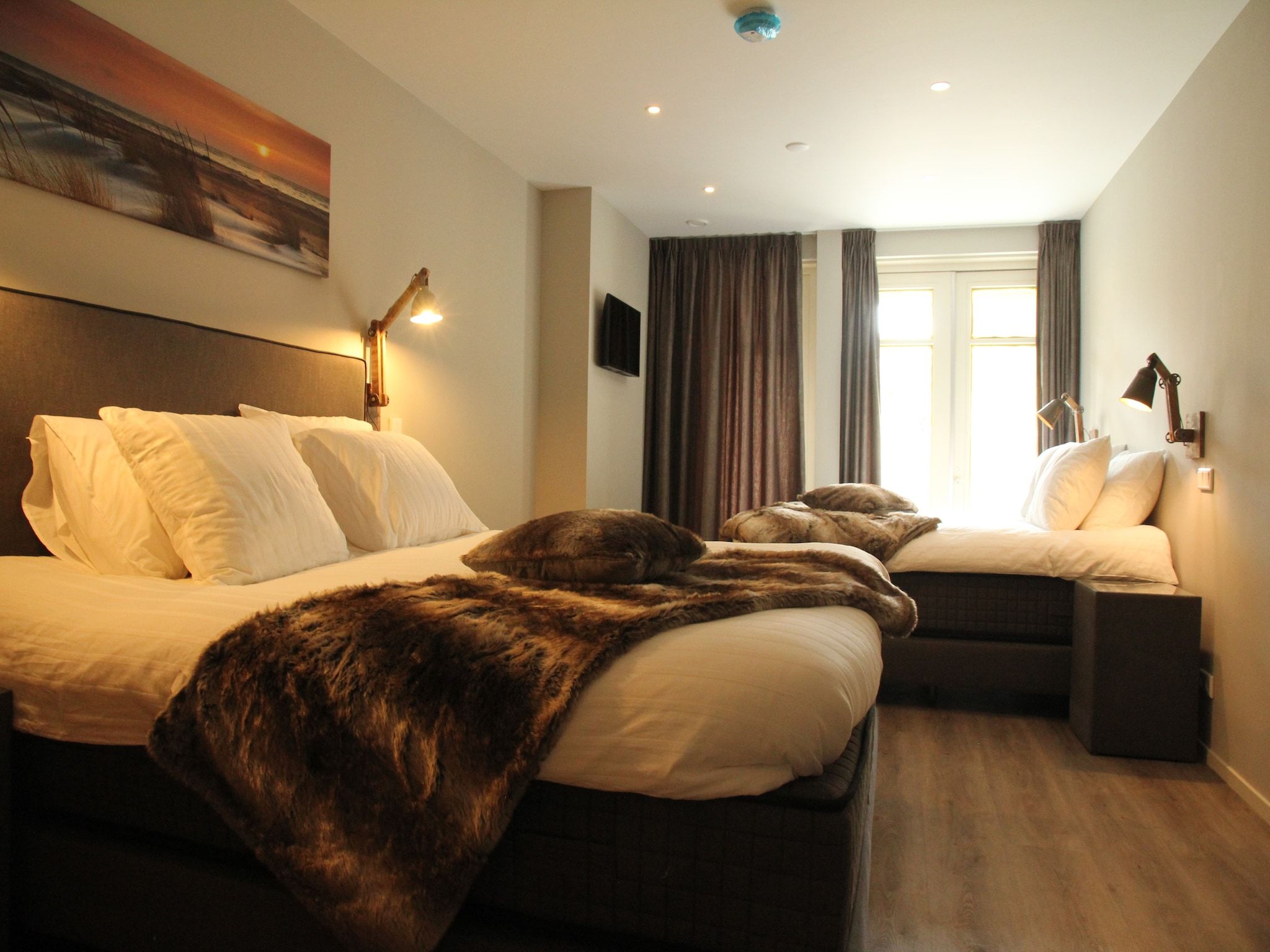 Een slaapkamer van Duinvilla Noordwijk in Noordwijk