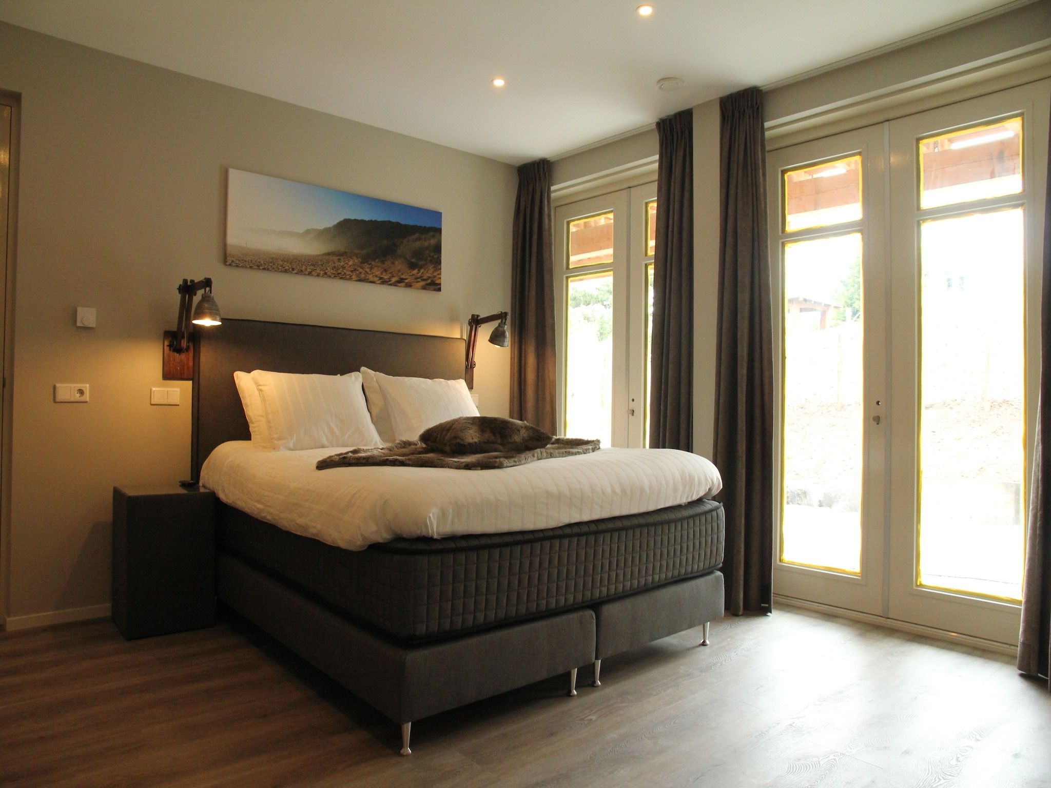 Een slaapkamer van Duinvilla Noordwijk in Noordwijk