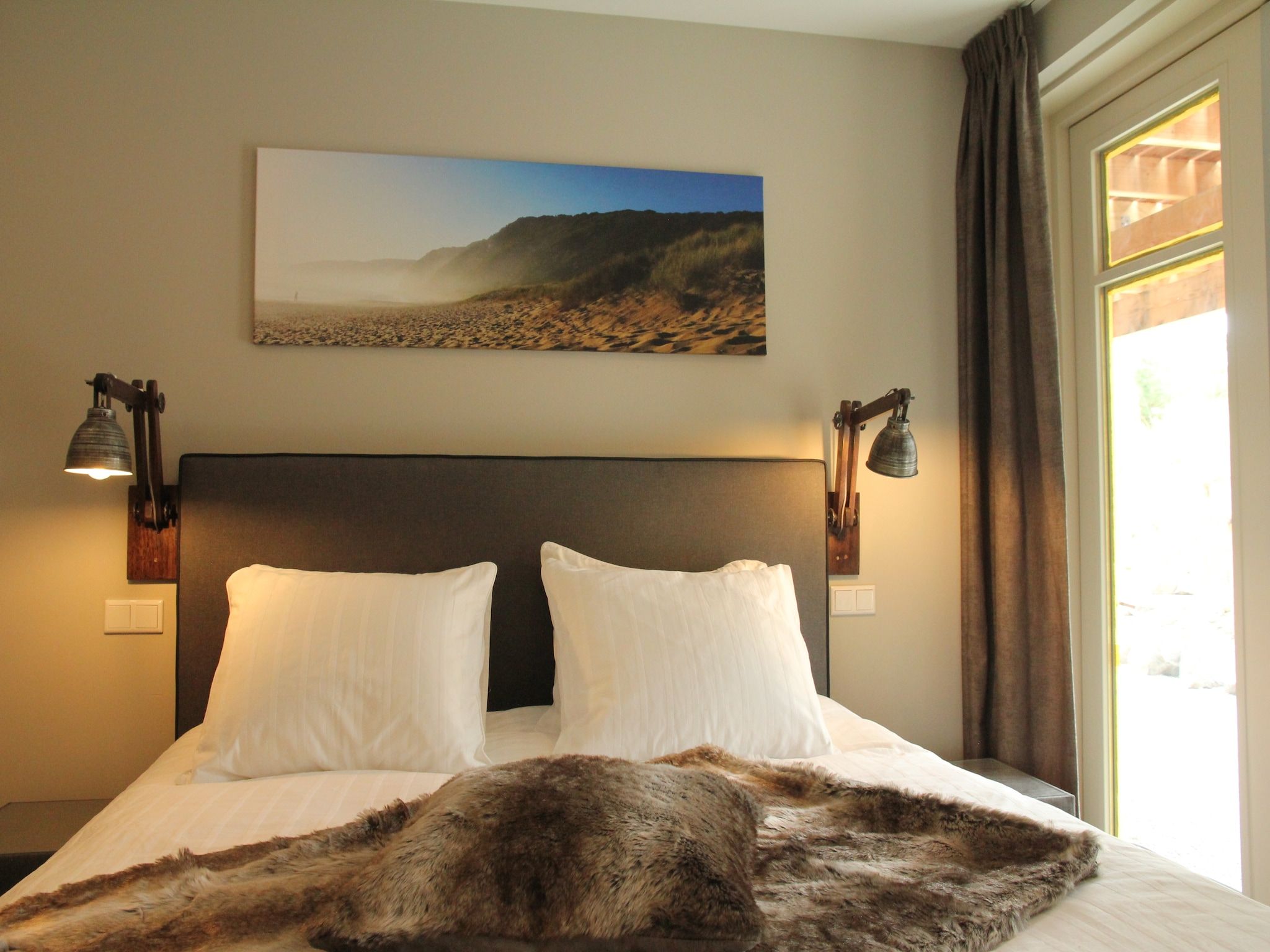 Een slaapkamer van Duinvilla Noordwijk in Noordwijk