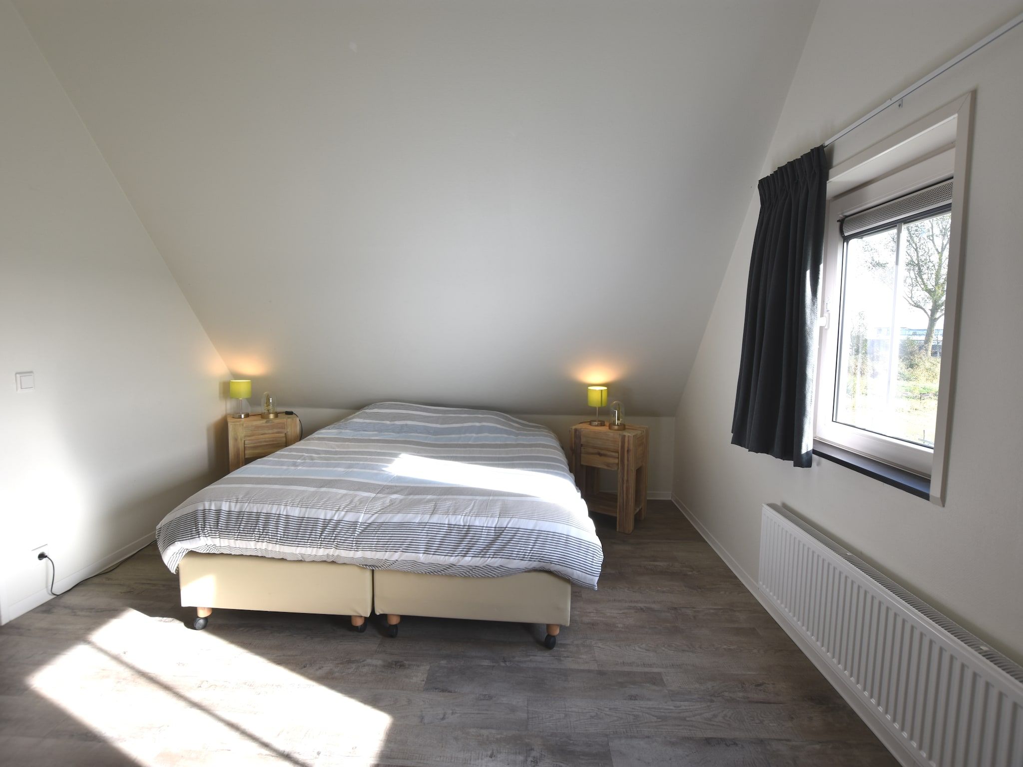 Een slaapkamer van Krokus 10 in Breskens