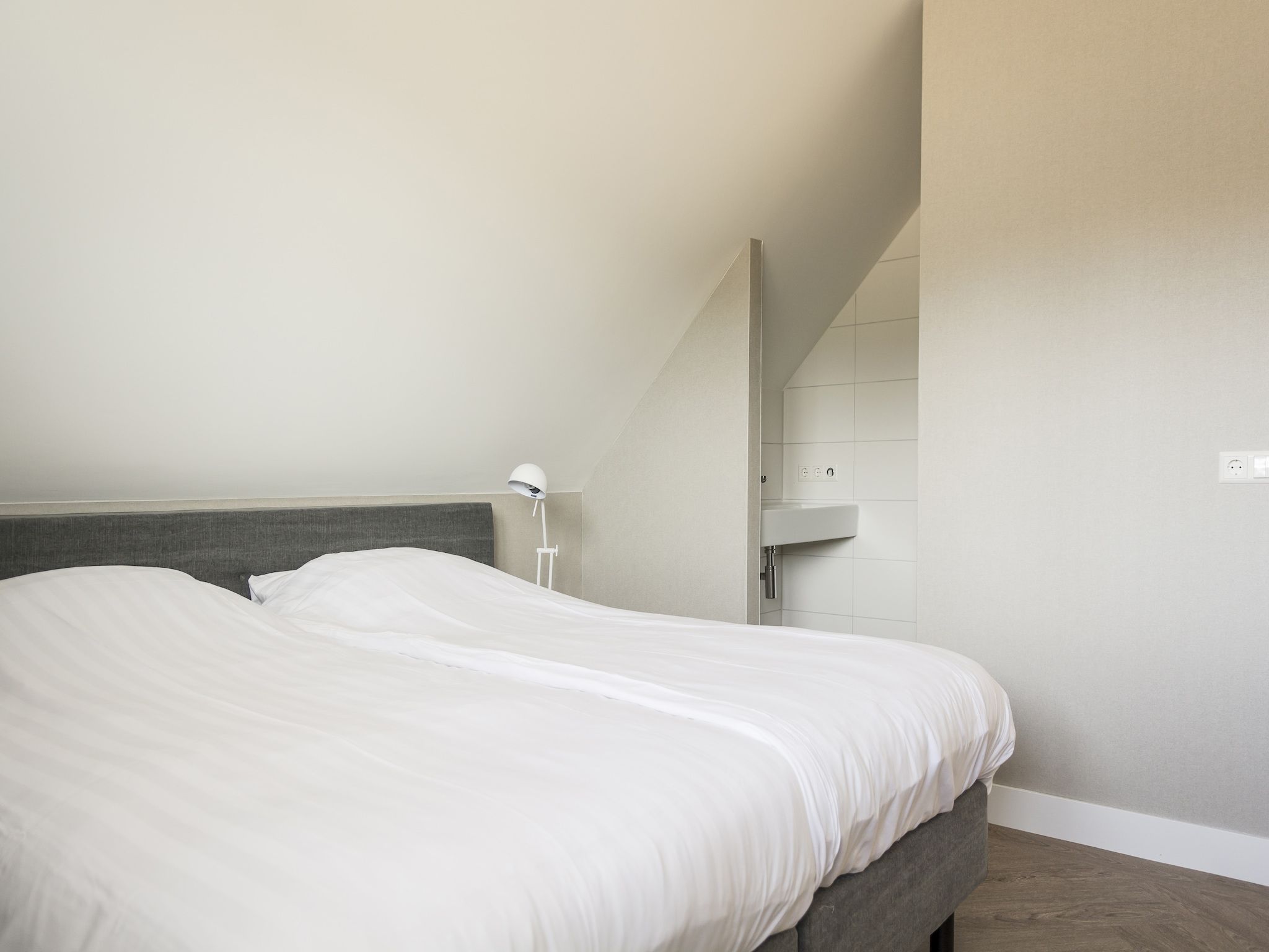 Een slaapkamer van Villa Bouwlust F Wellness in De Cocksdorp Texel
