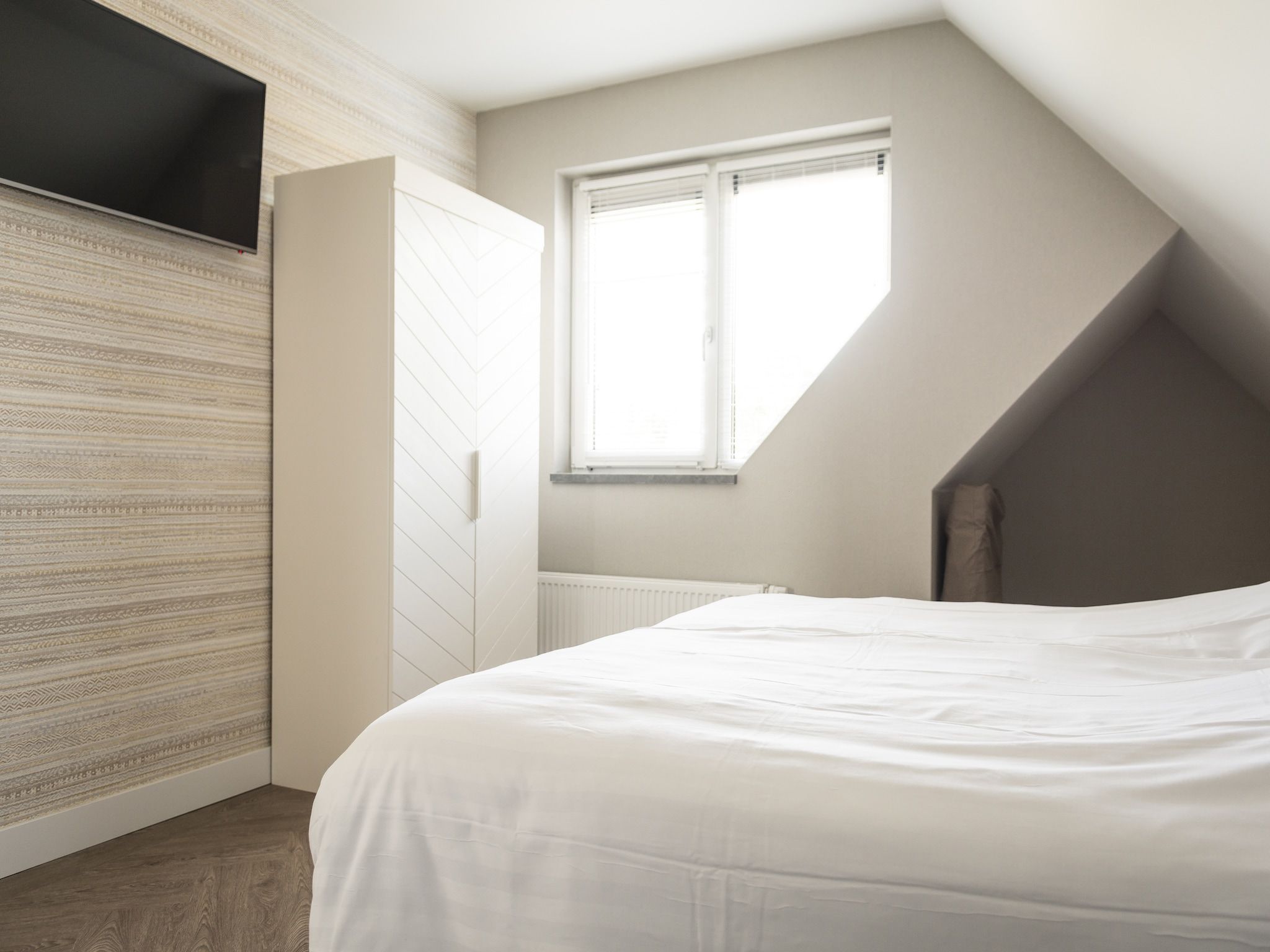 Een slaapkamer van Villa Bouwlust F Wellness in De Cocksdorp Texel