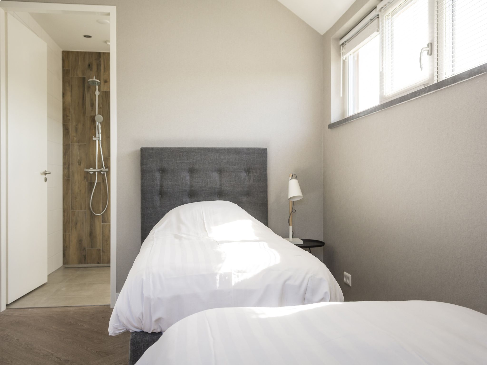 Een slaapkamer van Villa Bouwlust F Wellness in De Cocksdorp Texel