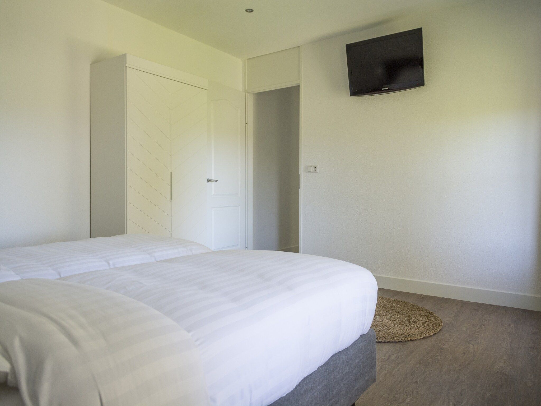 Een slaapkamer van Bouwlust G13 in De Cocksdorp Texel