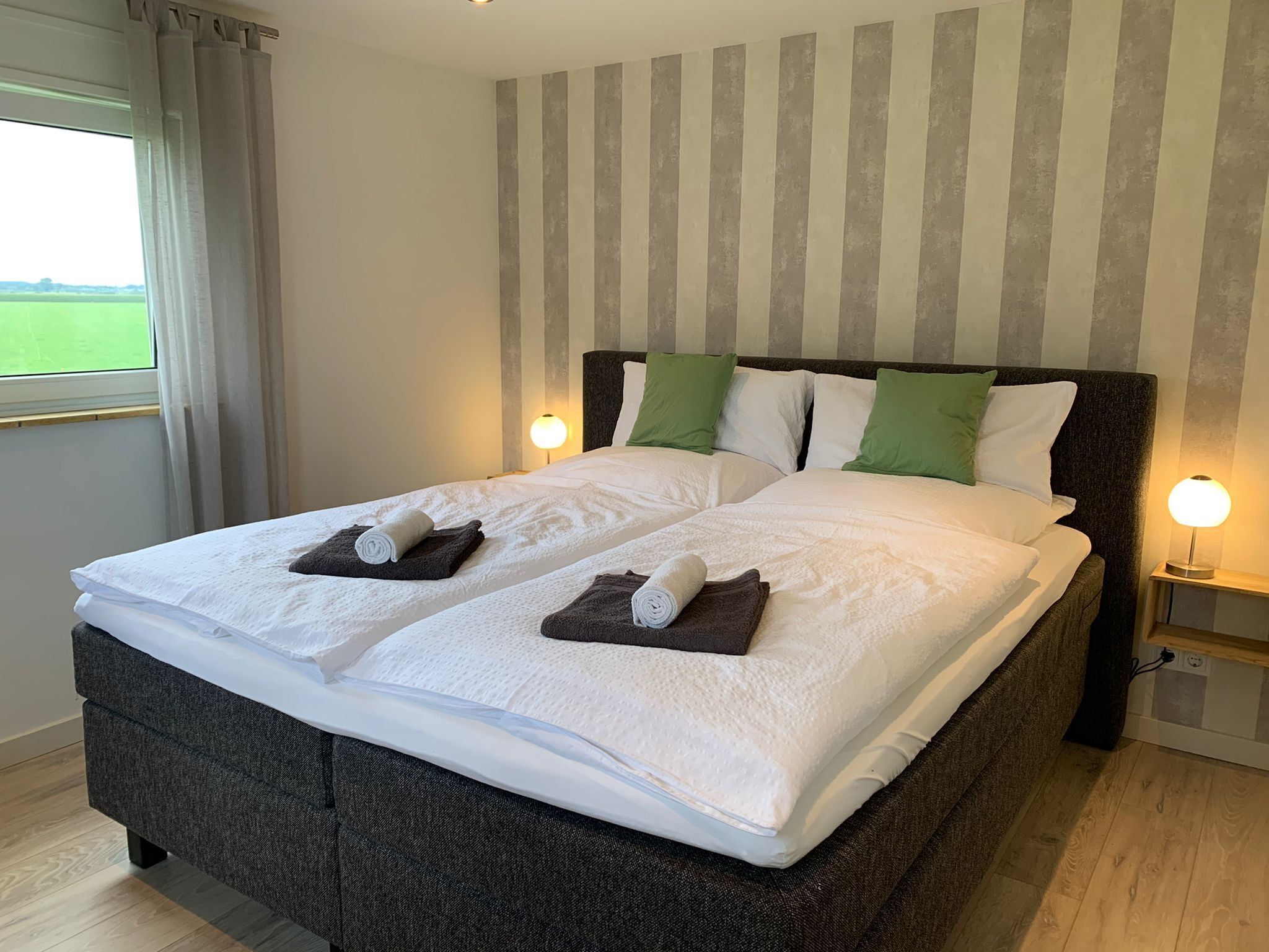 Een slaapkamer van Villa Grenszicht in Megchelen