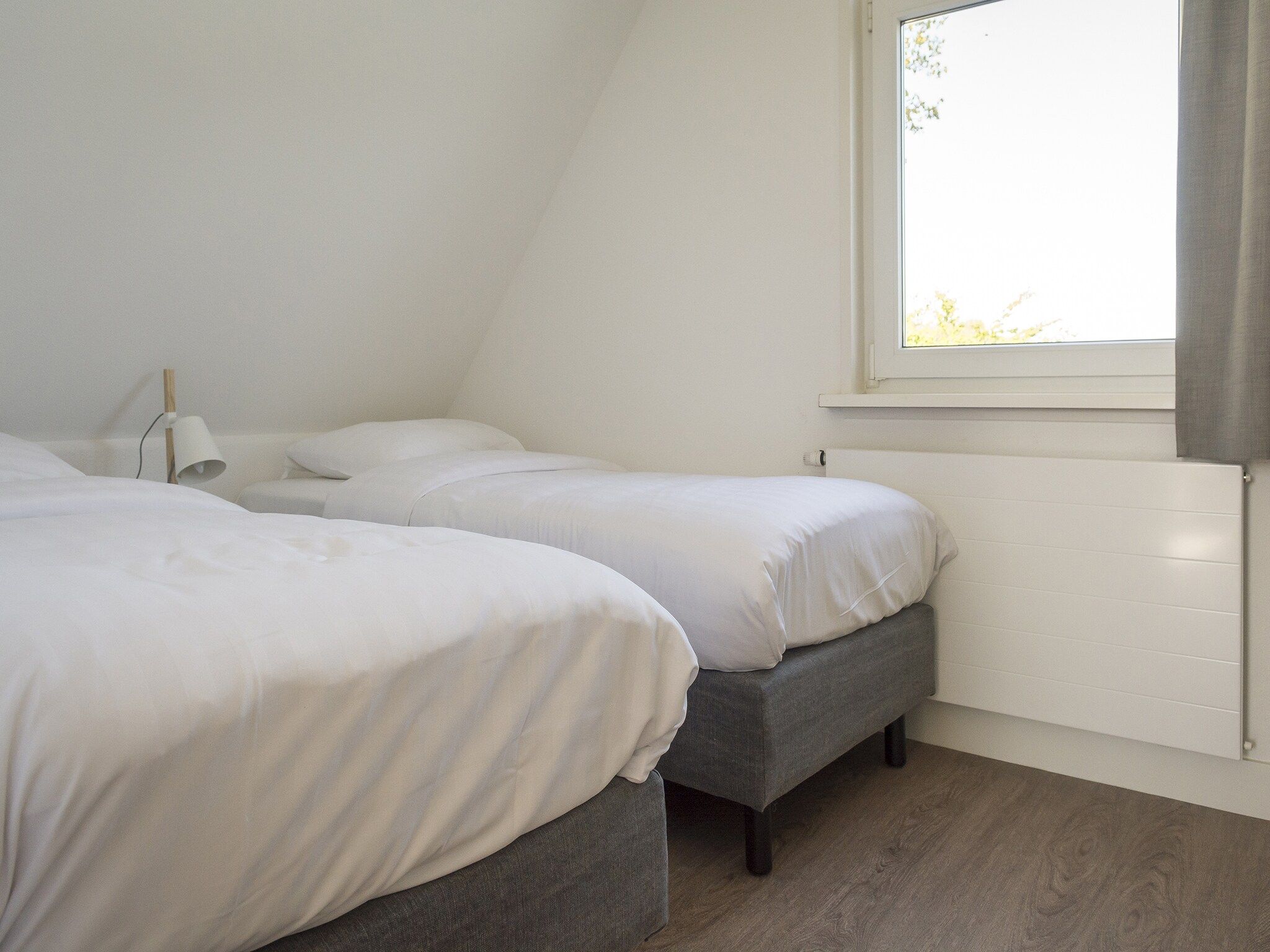 Een slaapkamer van Bouwlust E11 in De Cocksdorp Texel