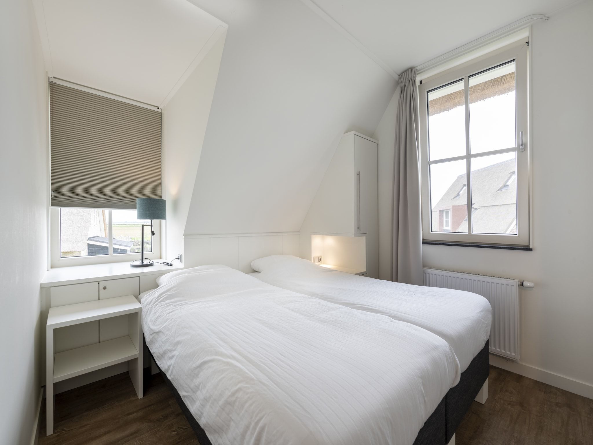 Een slaapkamer van Friese Meren Villa's 5 in Delfstrahuizen