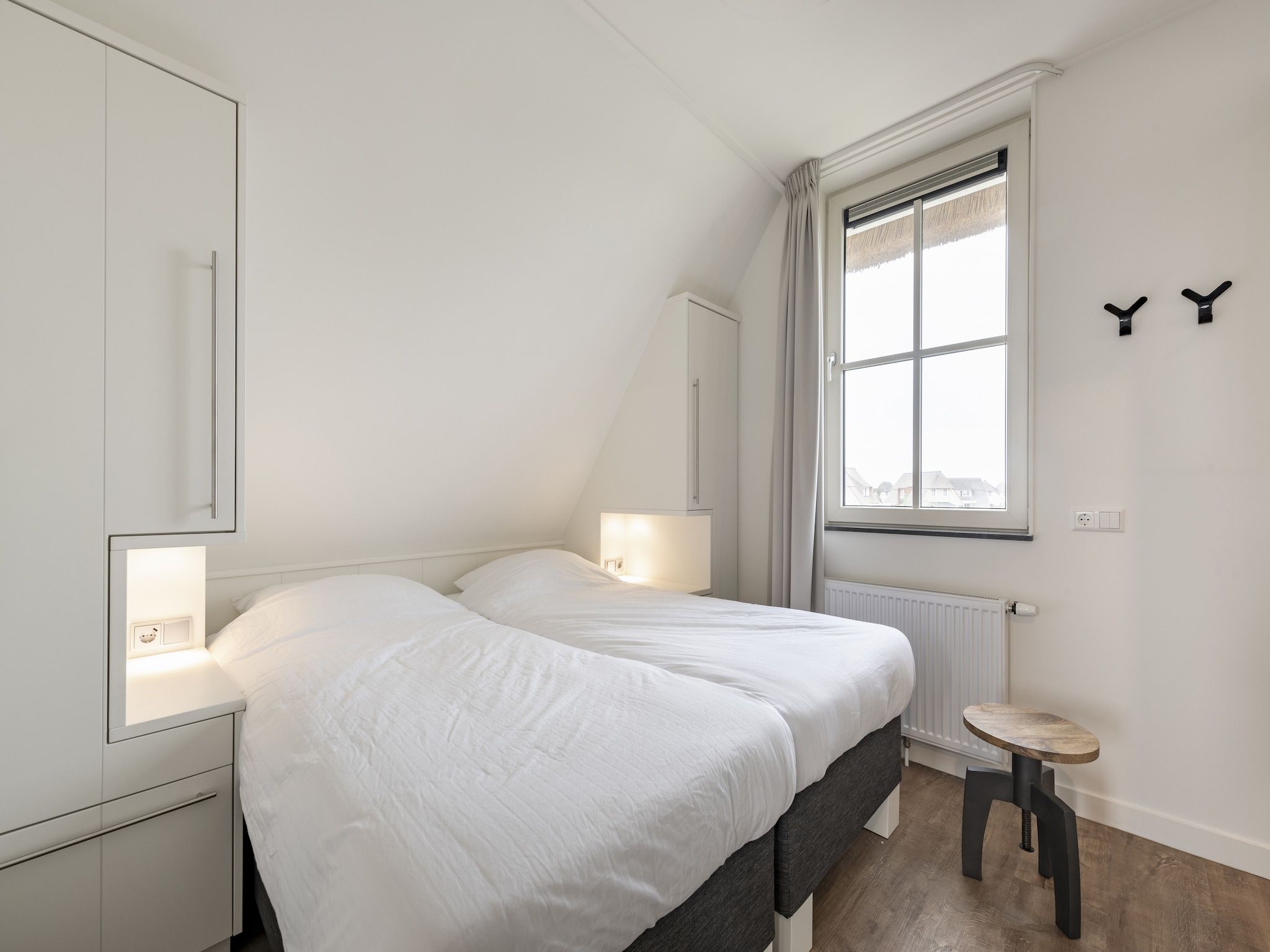 Een slaapkamer van Friese Meren Villa's 5 in Delfstrahuizen