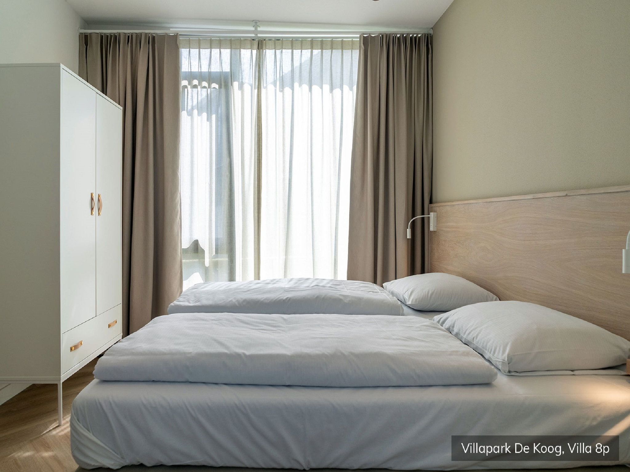 Een slaapkamer van Villapark De Koog 4 in De Koog