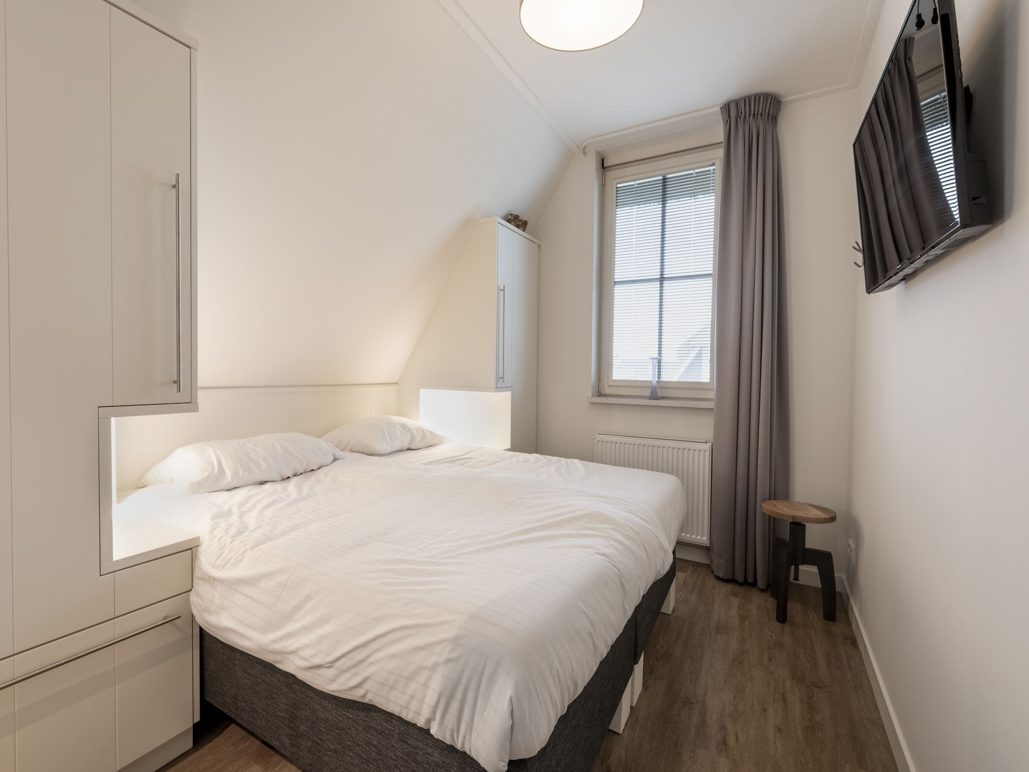 Een slaapkamer van Friese Meren Villa's 7 in Delfstrahuizen