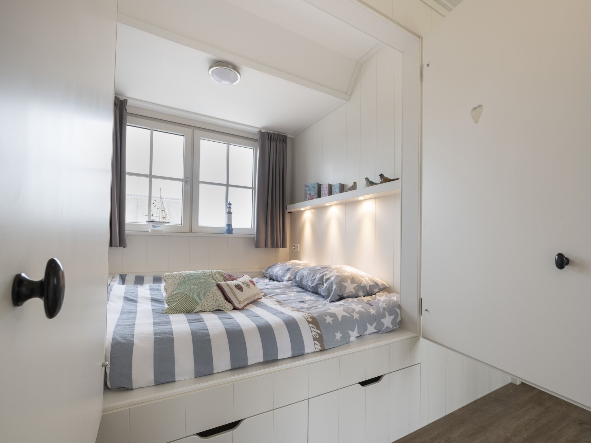 Een slaapkamer van Friese Meren Villa's 7 in Delfstrahuizen