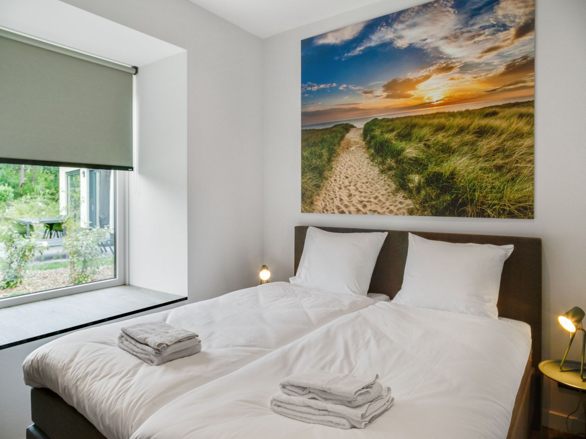 Een slaapkamer van De Koog nr 1 - 6 pers woning de luxe in De Koog Texel