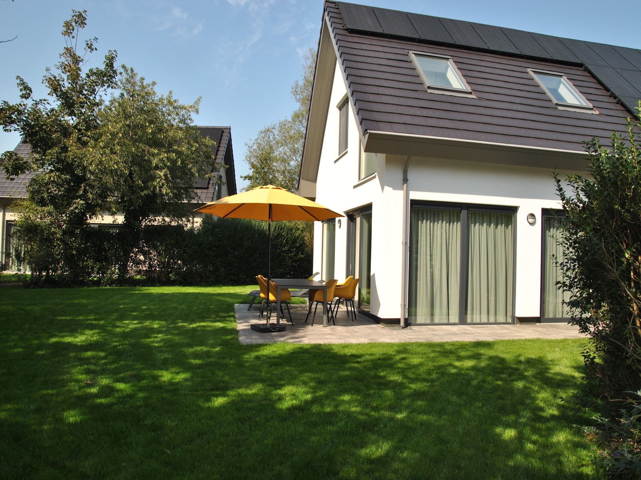 De tuin van De Koog nr 1 - 6 pers woning de luxe in De Koog Texel