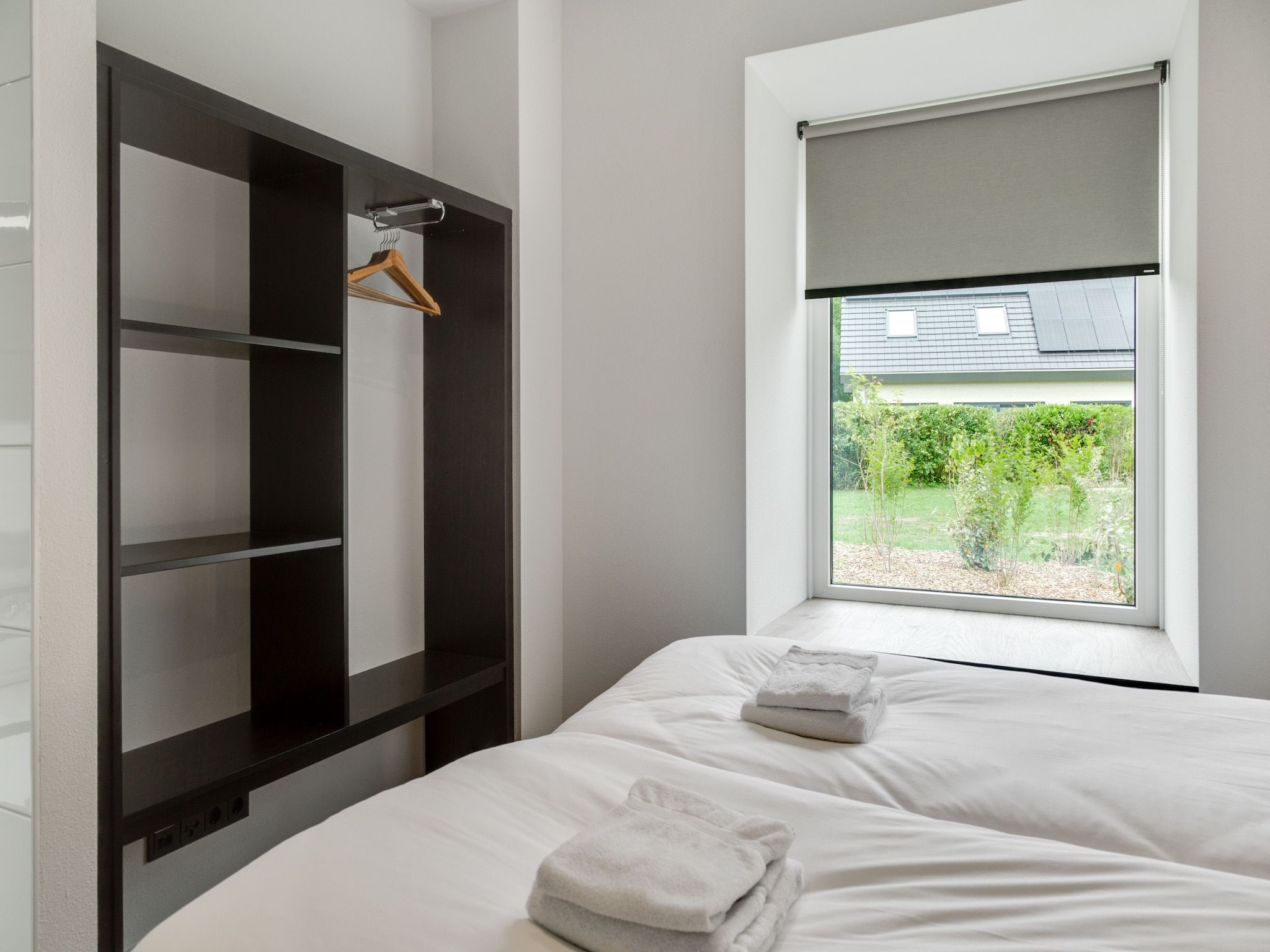 Een slaapkamer van De Koog  nr 5 - 6 pers woning de luxe in De Koog Texel