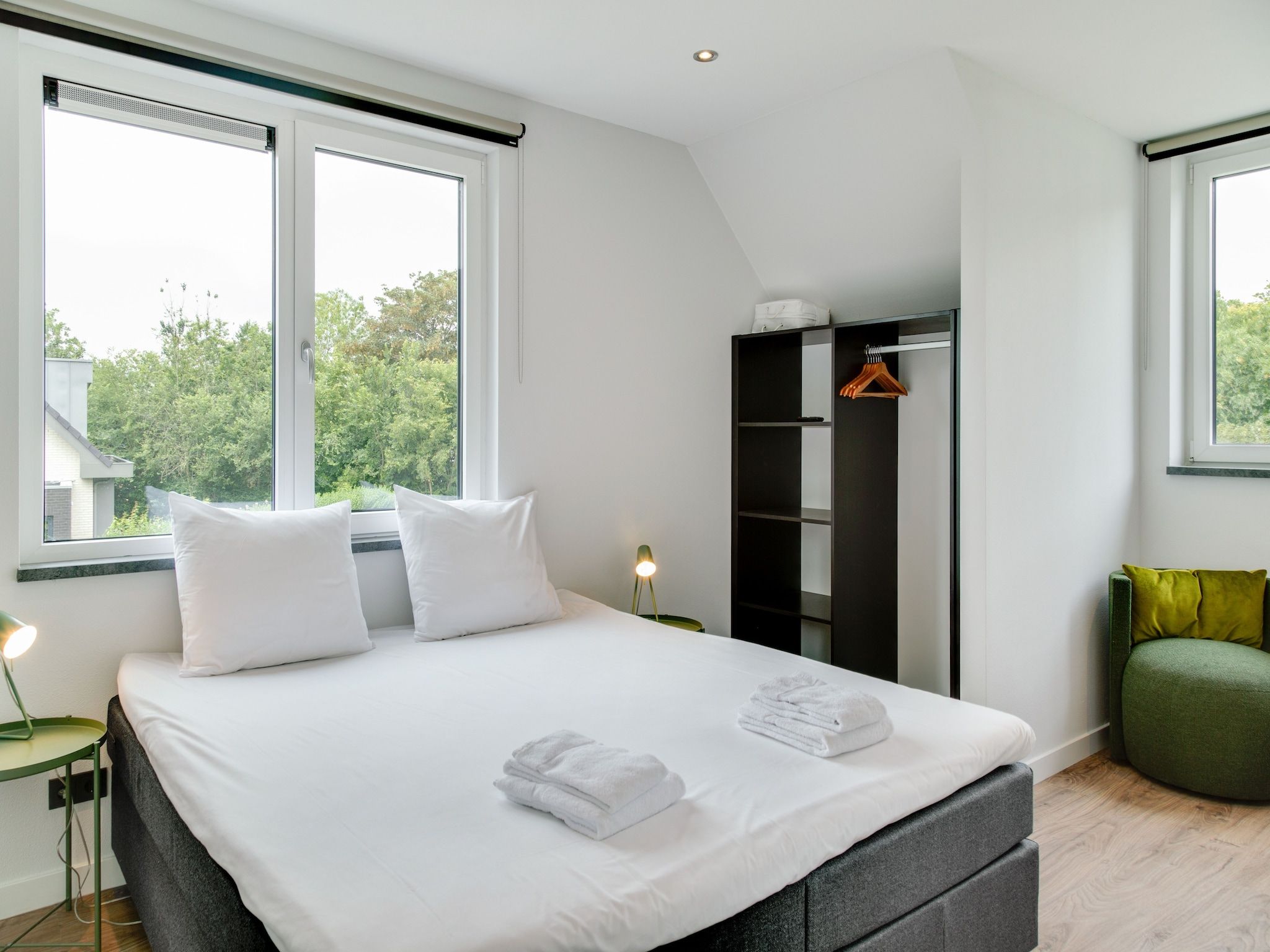 Een slaapkamer van De Koog  nr 5 - 6 pers woning de luxe in De Koog Texel