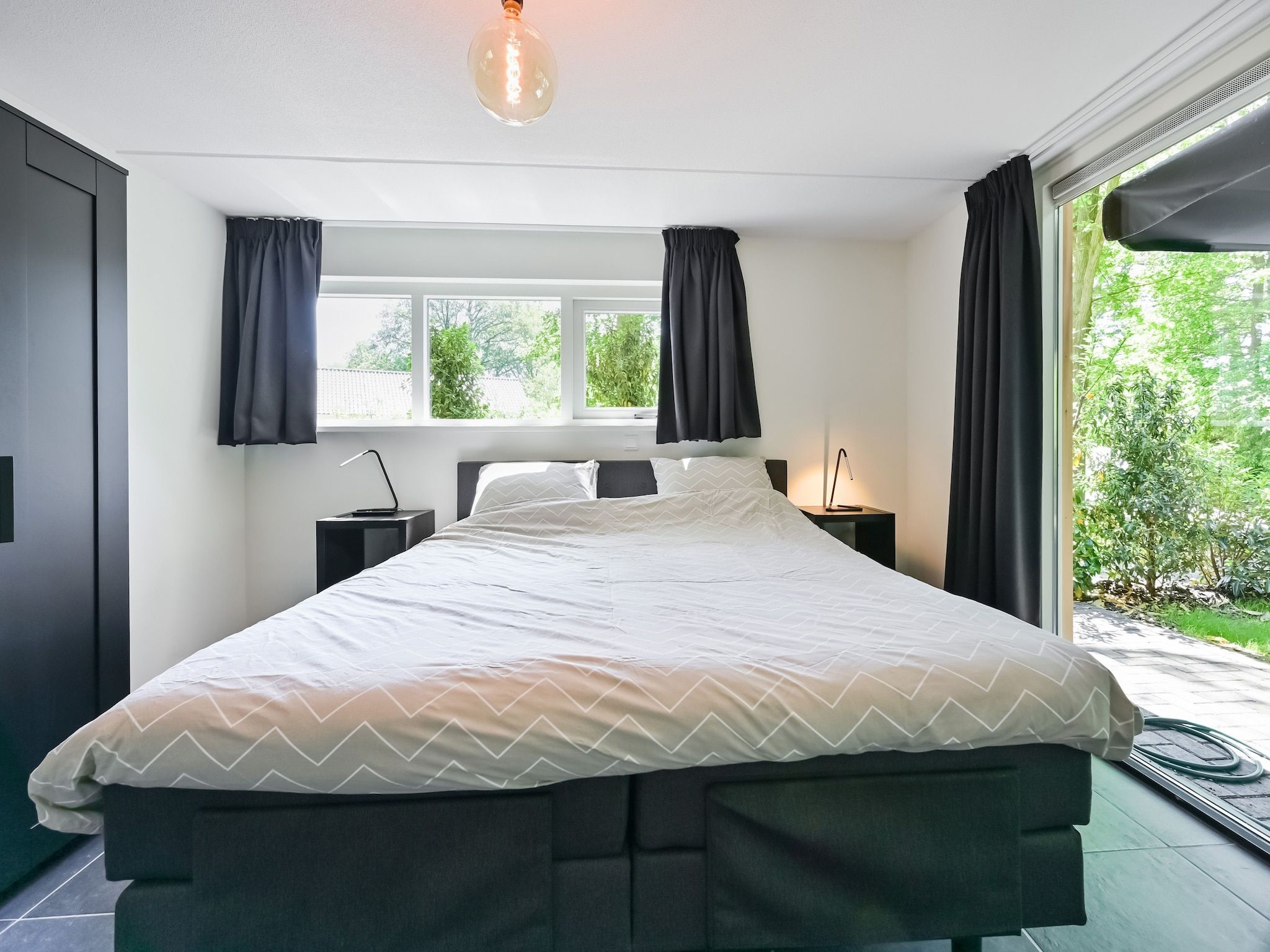 Een slaapkamer van Uitzicht in Reutum