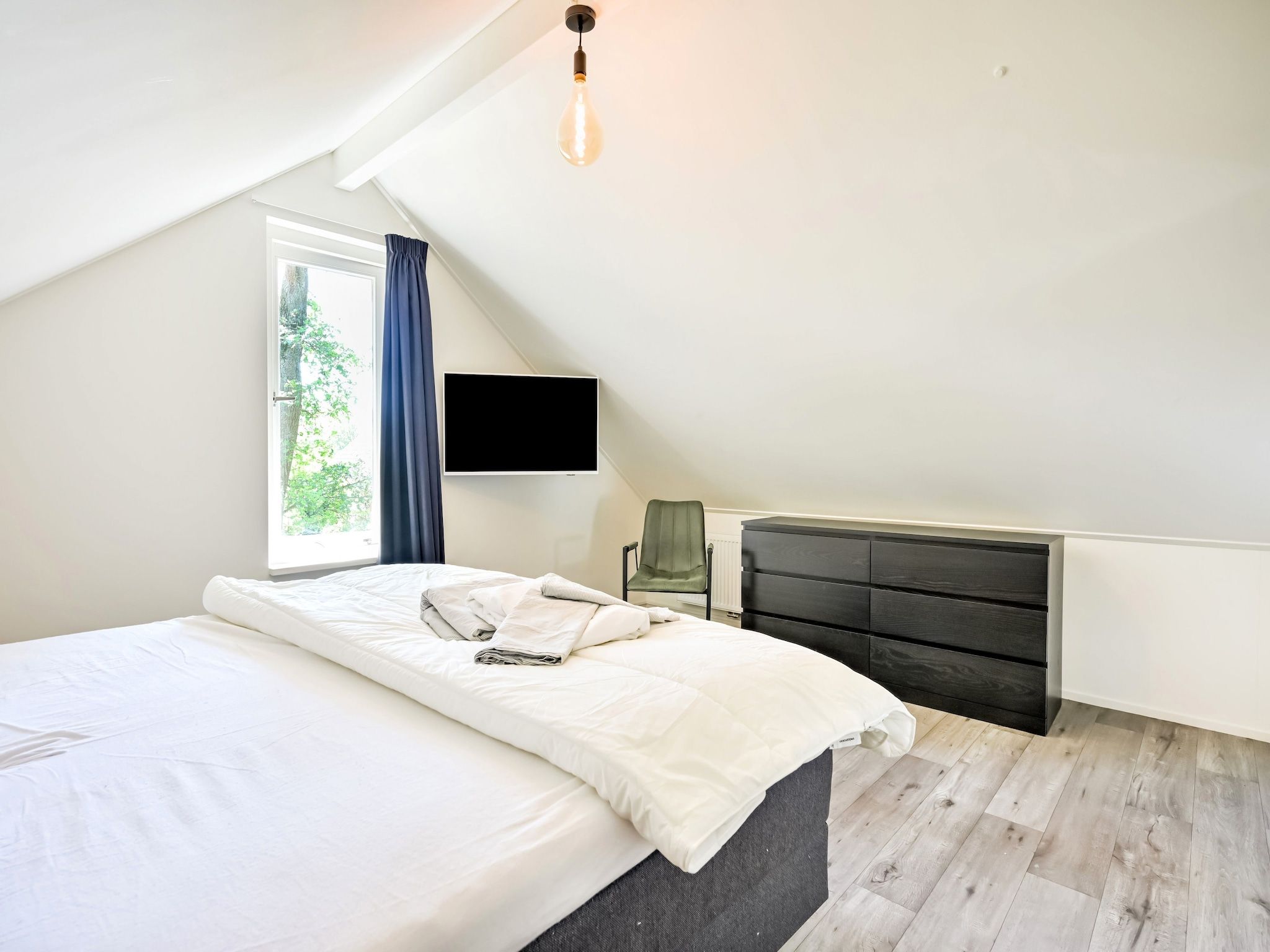 Een slaapkamer van Uitzicht in Reutum