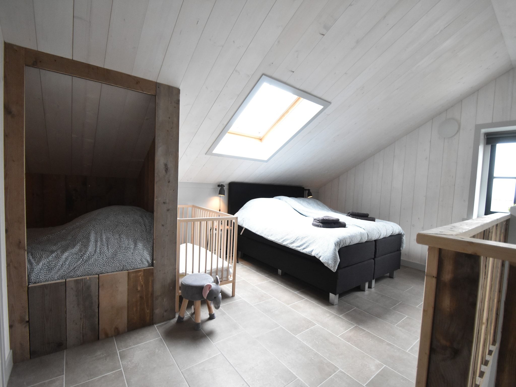 Een slaapkamer van Hazenborgh - Duinhuis 1 in Callantsoog