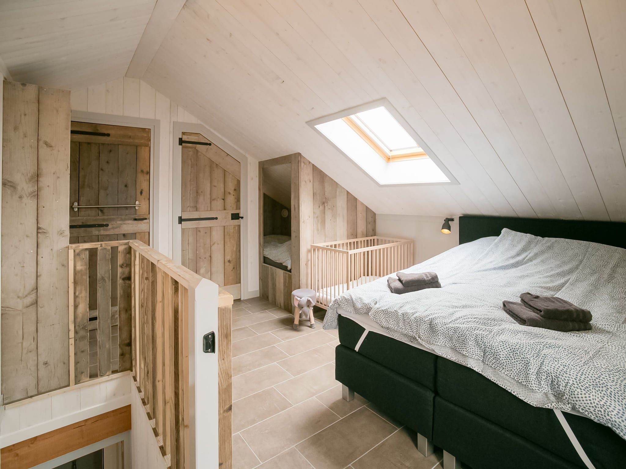 Een slaapkamer van Hazenborgh - Duinhuis 1 in Callantsoog