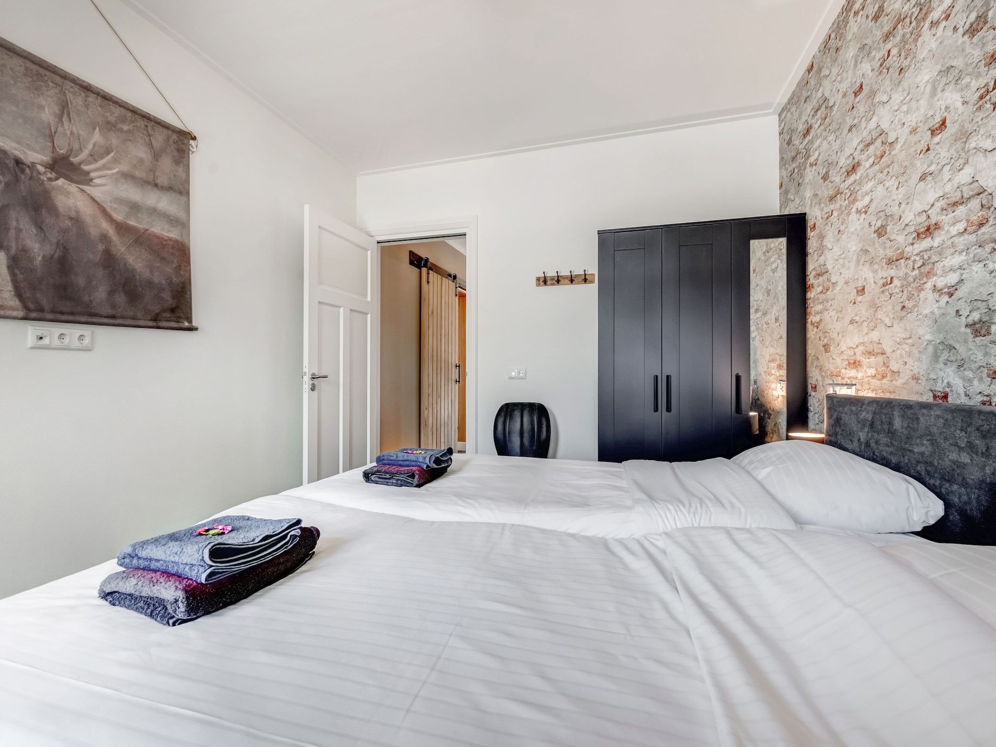 Een slaapkamer van Boerderij Koatstertille in Friesland