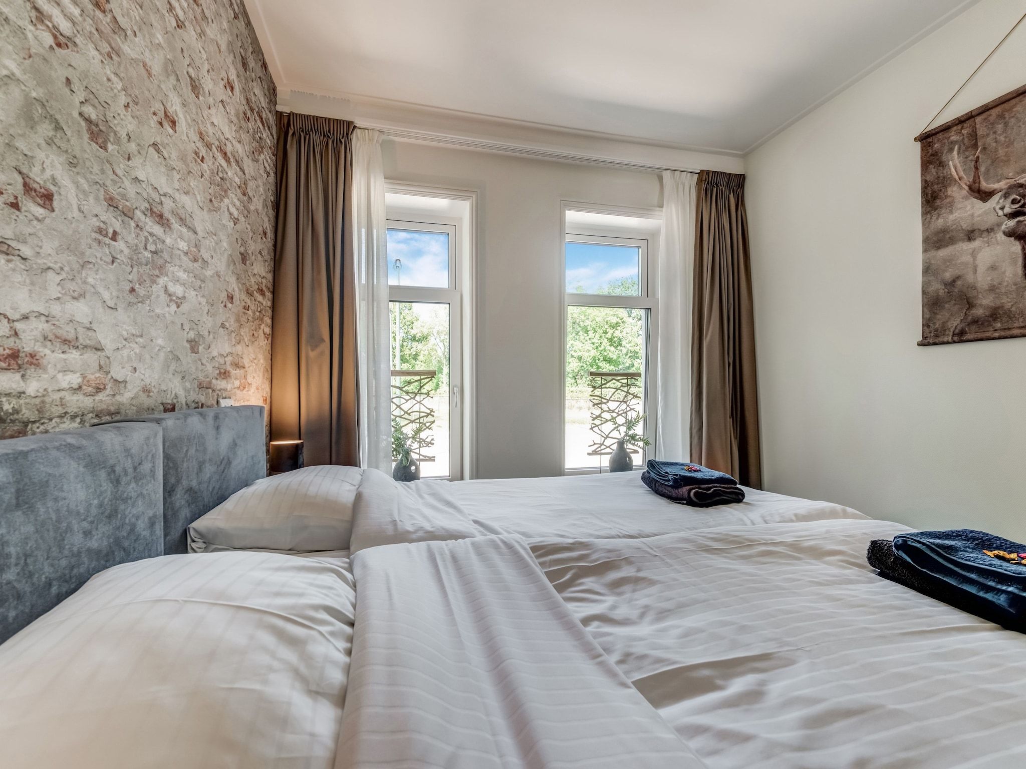 Een slaapkamer van Boerderij Koatstertille in Friesland