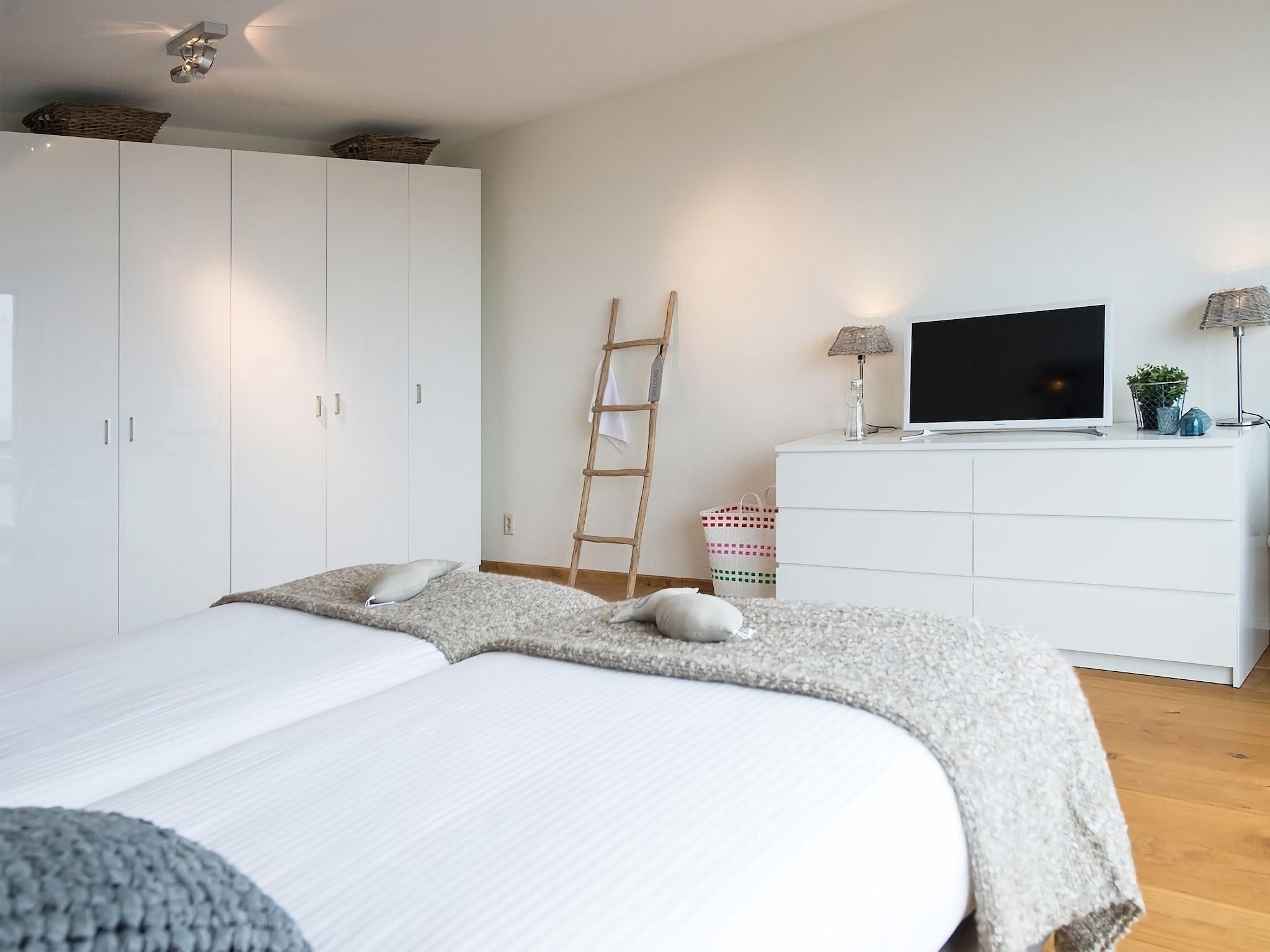 Een slaapkamer van Scheveningen Harbour 32 in Den Haag