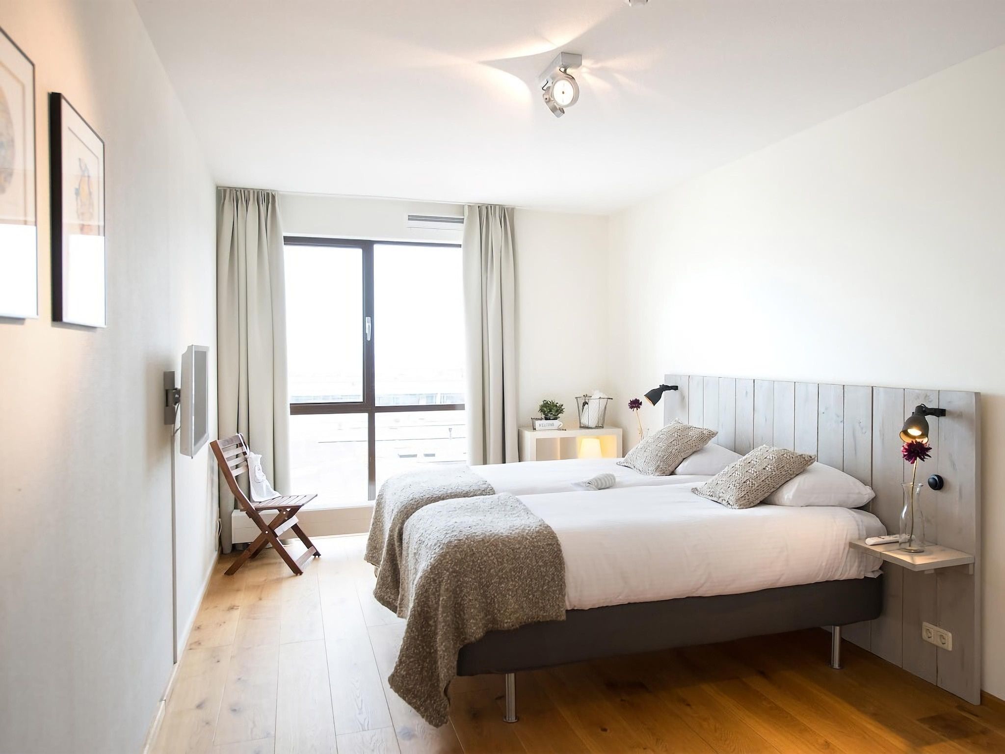 Een slaapkamer van Scheveningen Harbour 32 in Den Haag