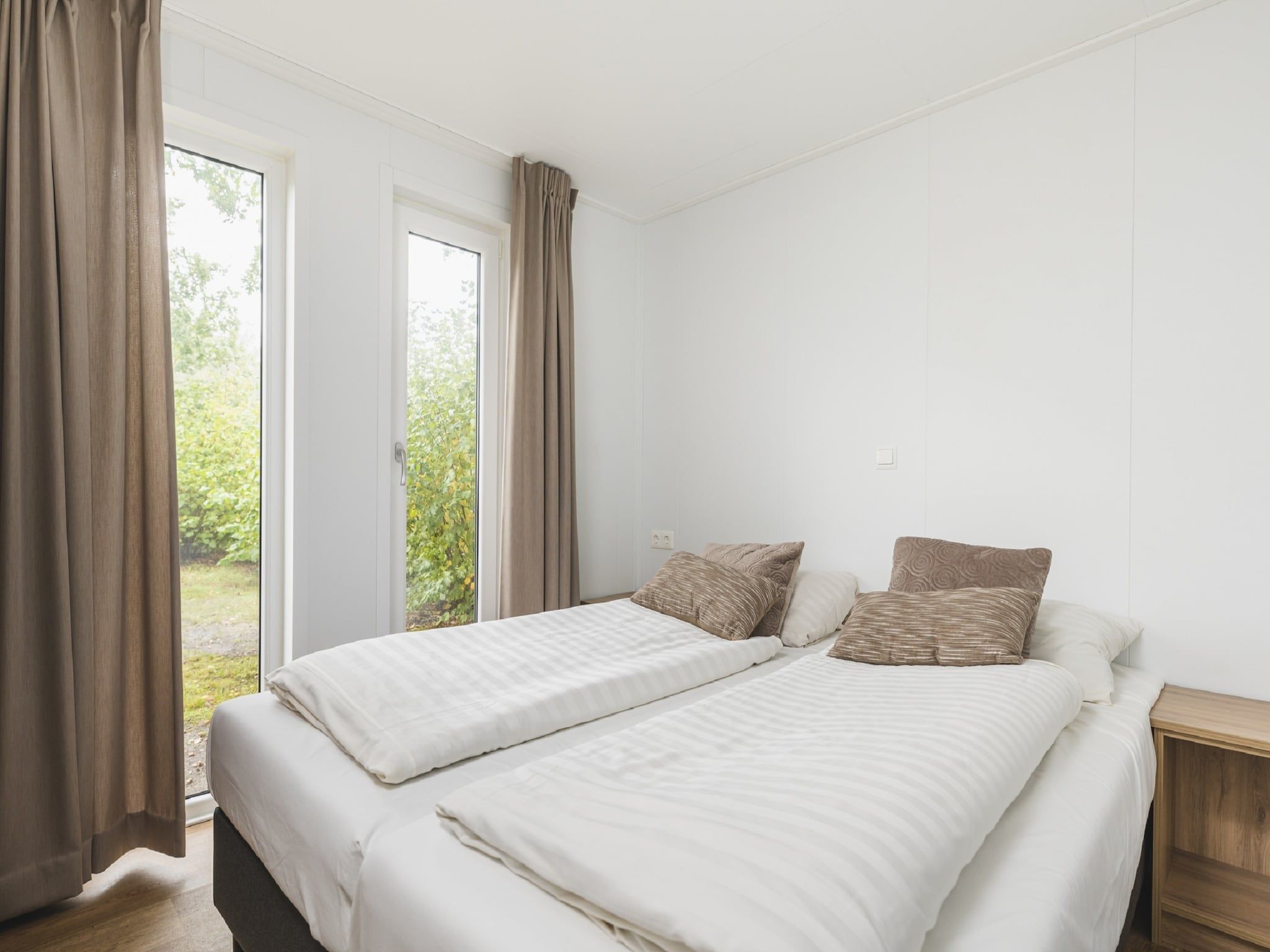 Een slaapkamer van Vakantiepark Mölke 29 in Zuna