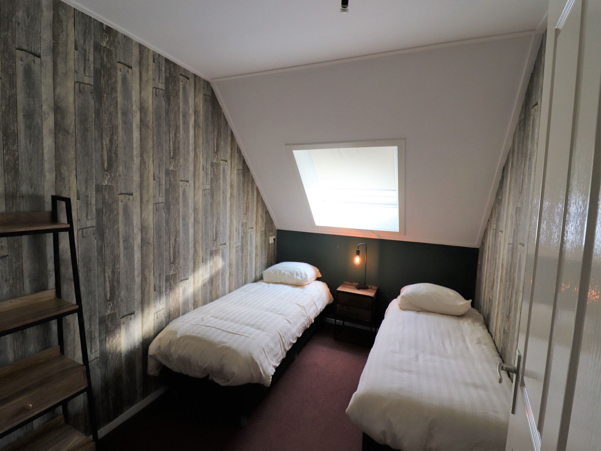 Een slaapkamer van Woonboerderij Bij Erve Mulder in Dalerveen