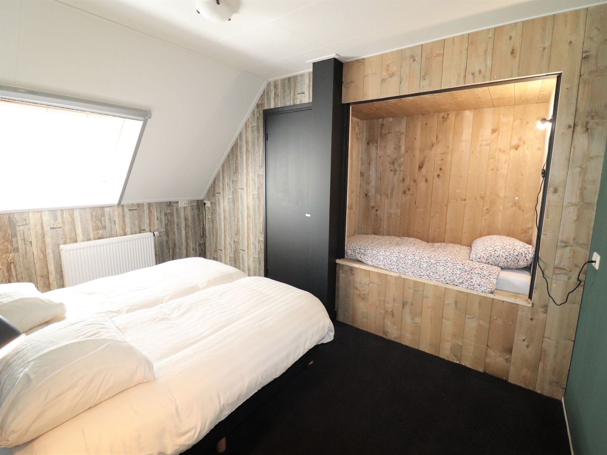 Een slaapkamer van Woonboerderij Bij Erve Mulder in Dalerveen
