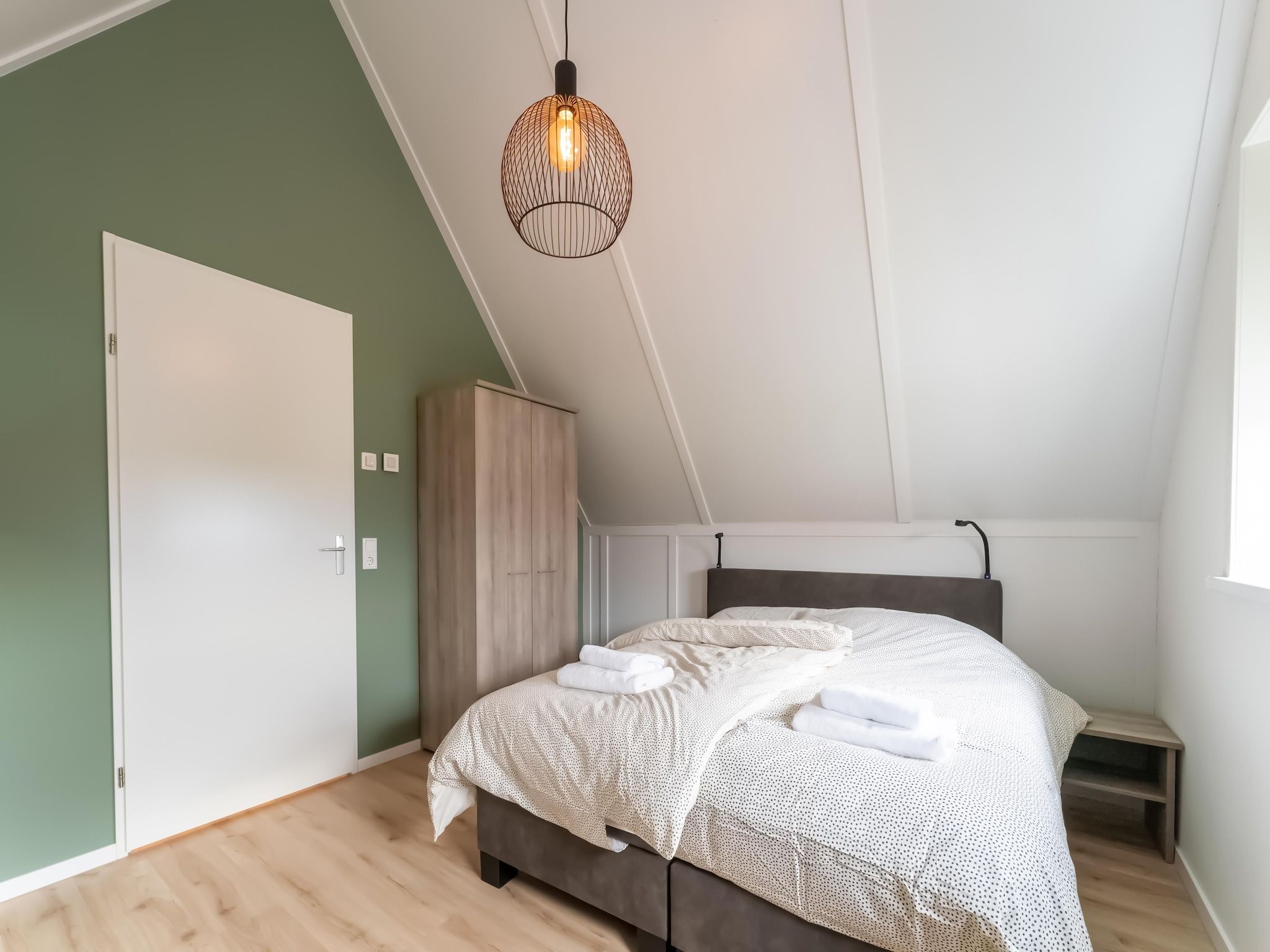Een slaapkamer van De Reiger Huis Nr 46 in Scherpenisse