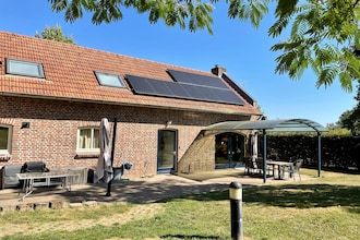 Koetshuis bij Roermond met tuin in Sint Odilienberg