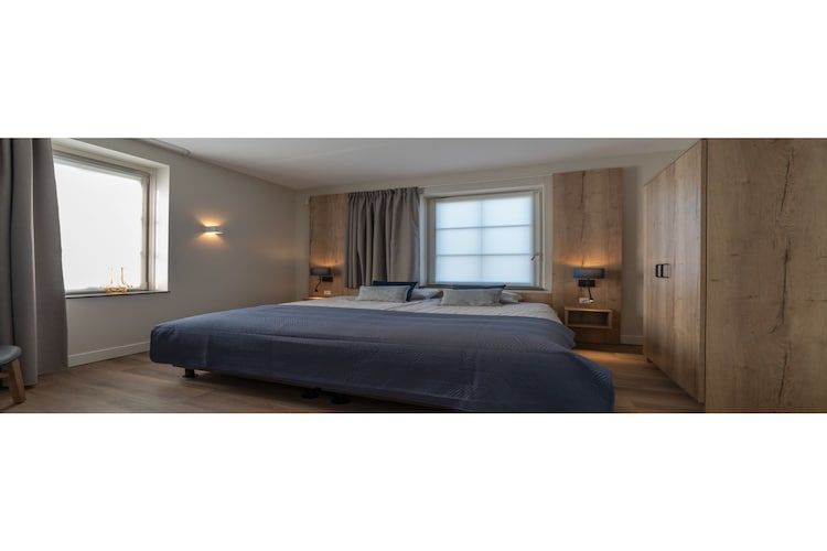 Een slaapkamer van Zeeuwse Parel luxe Appartement 4 pers 2 bdk in Colijnsplaat