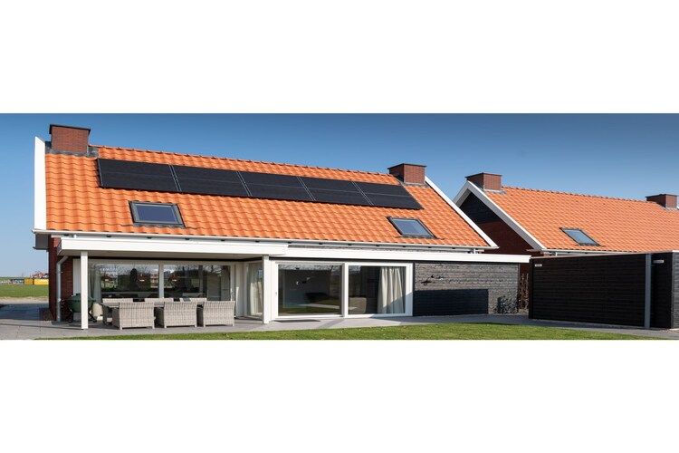 De buitenkant van 6 persoons vrijstaand met sauna - 1 in Colijnsplaat